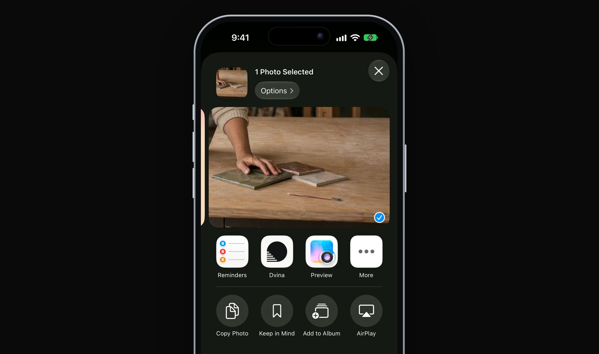 The share sheet on an iPhone over a photo of kitchen tile samples, with Keep in Mind under Dvina.
