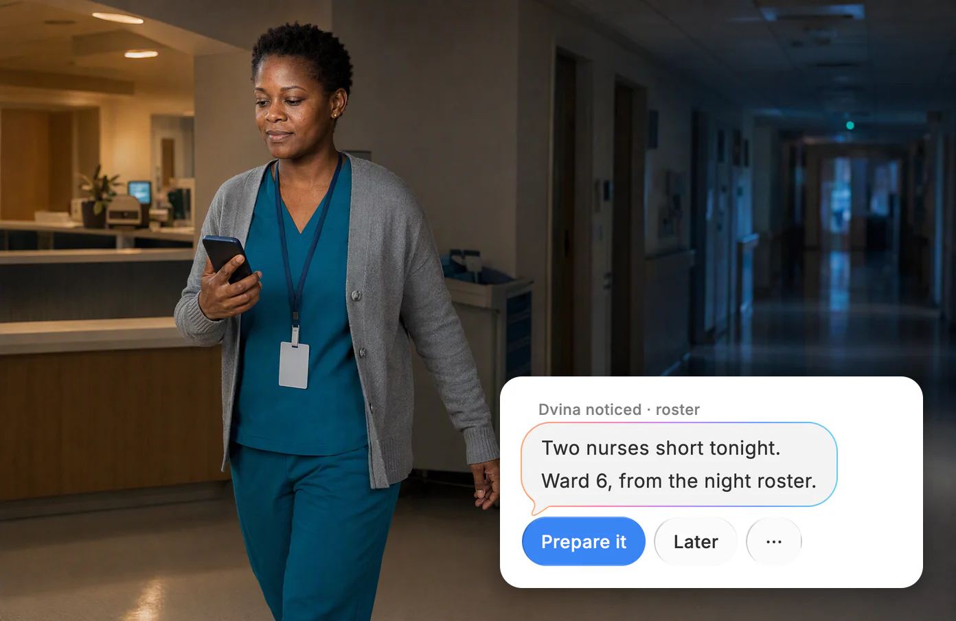 A nurse manager walks a quiet ward corridor at 2 AM reading her phone. Dvina: two nurses short tonight, from the night roster.