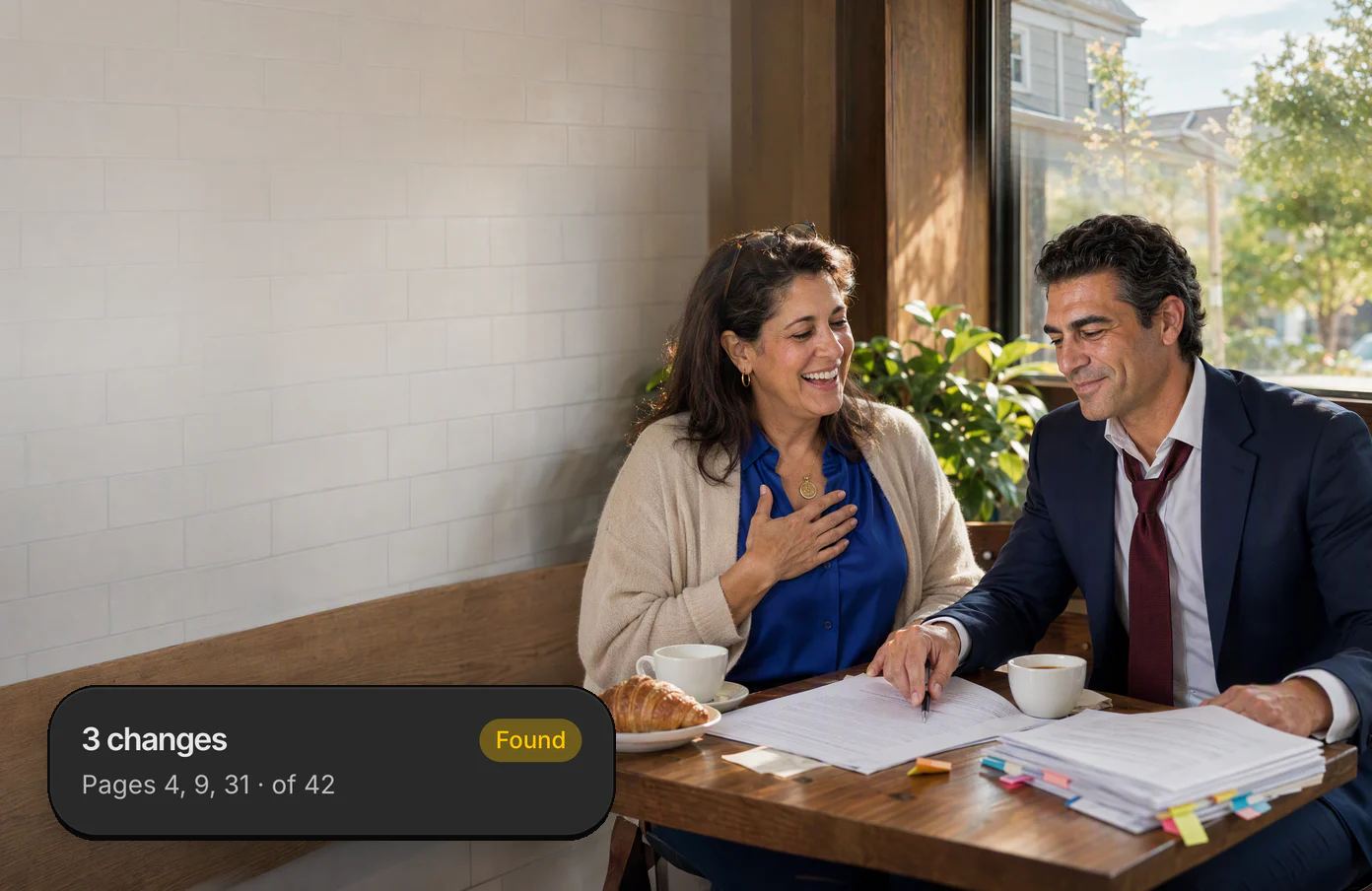 A lawyer at a café table taps his pen on page 9 of his client’s printed lease, and she laughs with relief; his Dvina card: three changes, on pages 4, 9 and 31 of 42.